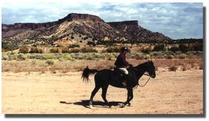 Elliott B. Oppenheim horse back riding.